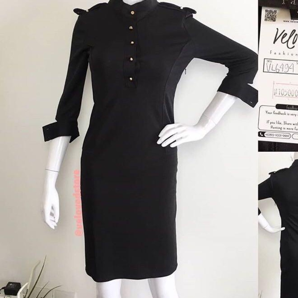 Paiye black form fitting dress. Size large. Solid black with gold buttons & trim